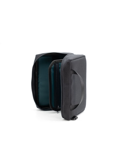 Teal-lined radio holder case with front pocket and zipper, side view