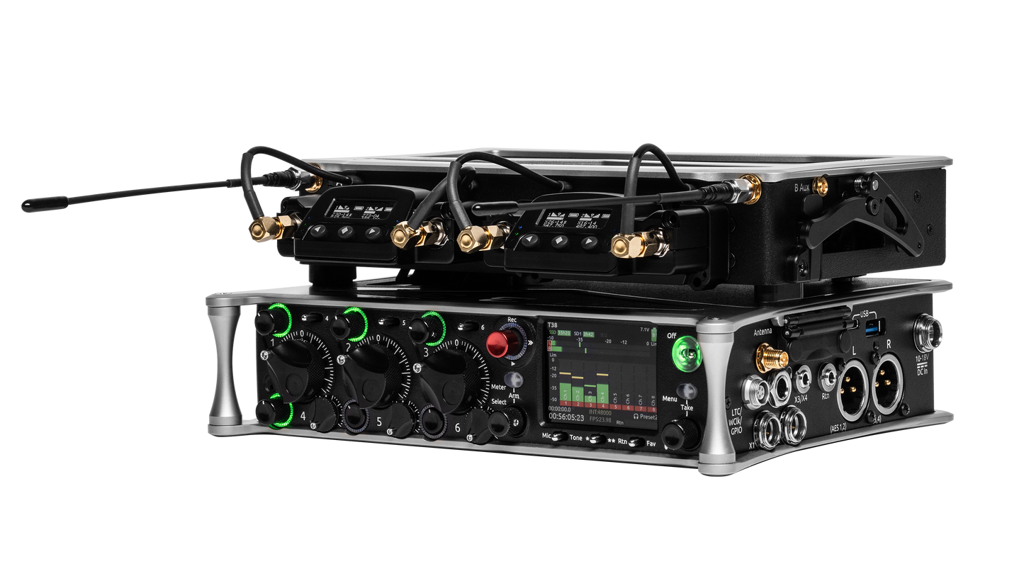 Audio device side view with multi-knob panel, color display, and gold-cabled connectors
