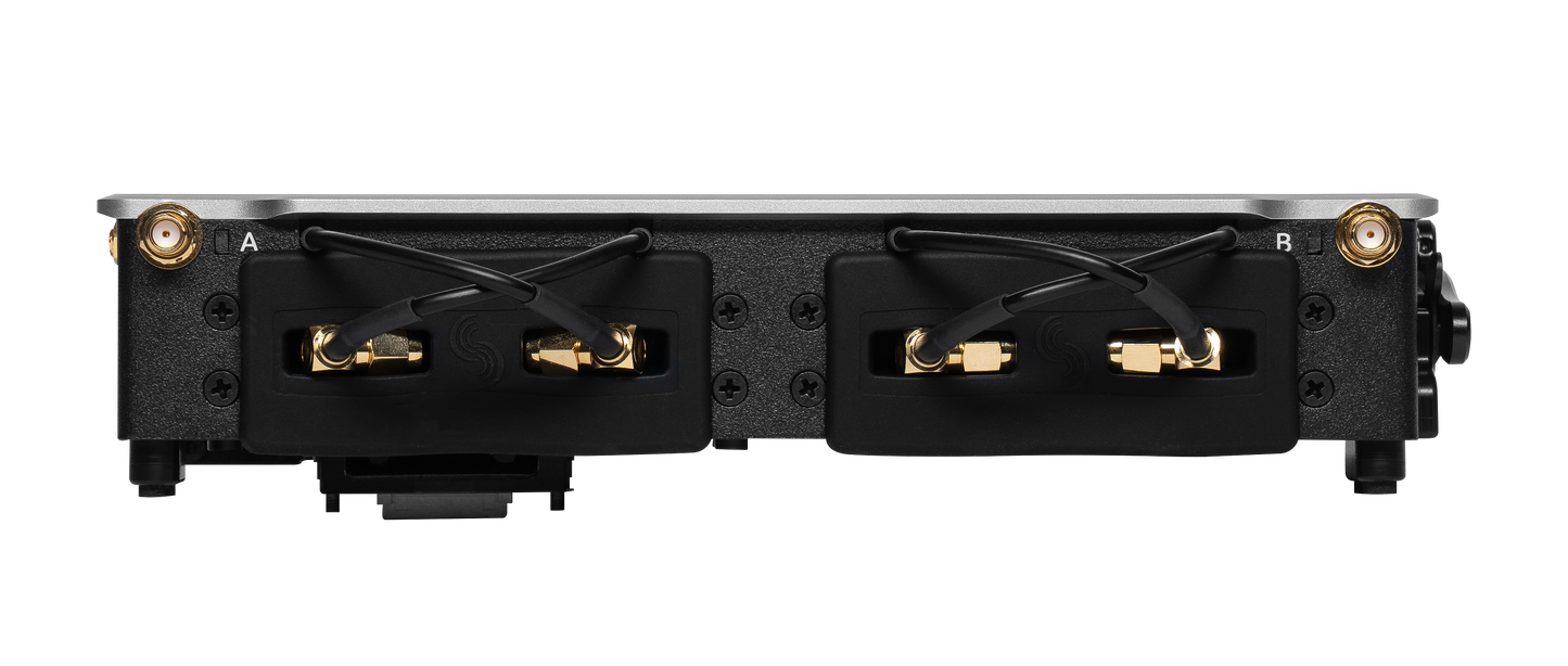 Audio device rear connector panel with gold BNC ports and labeled cable inputs