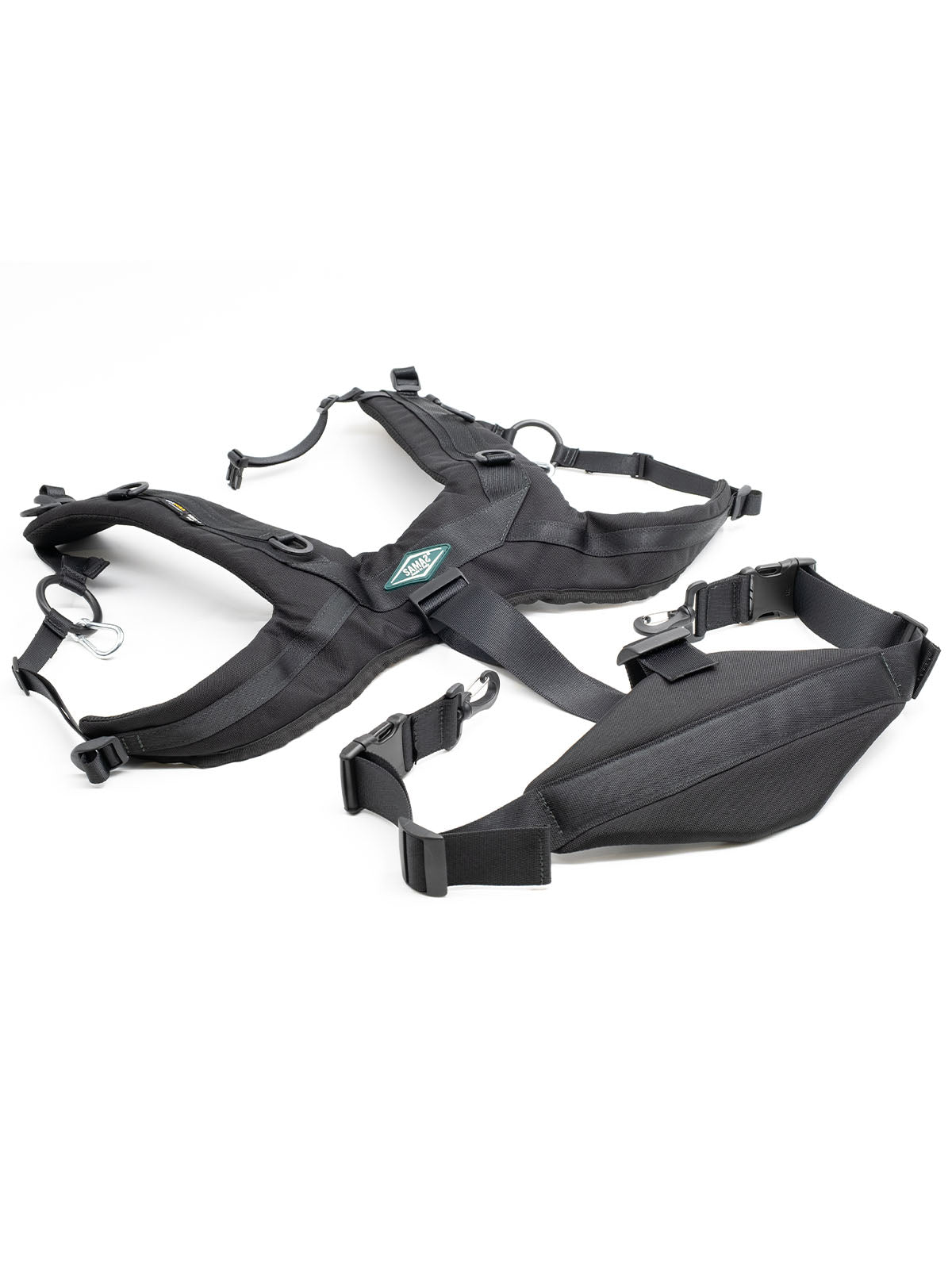 Black adjustable harness with multiple straps, buckles, and D-ring connectors