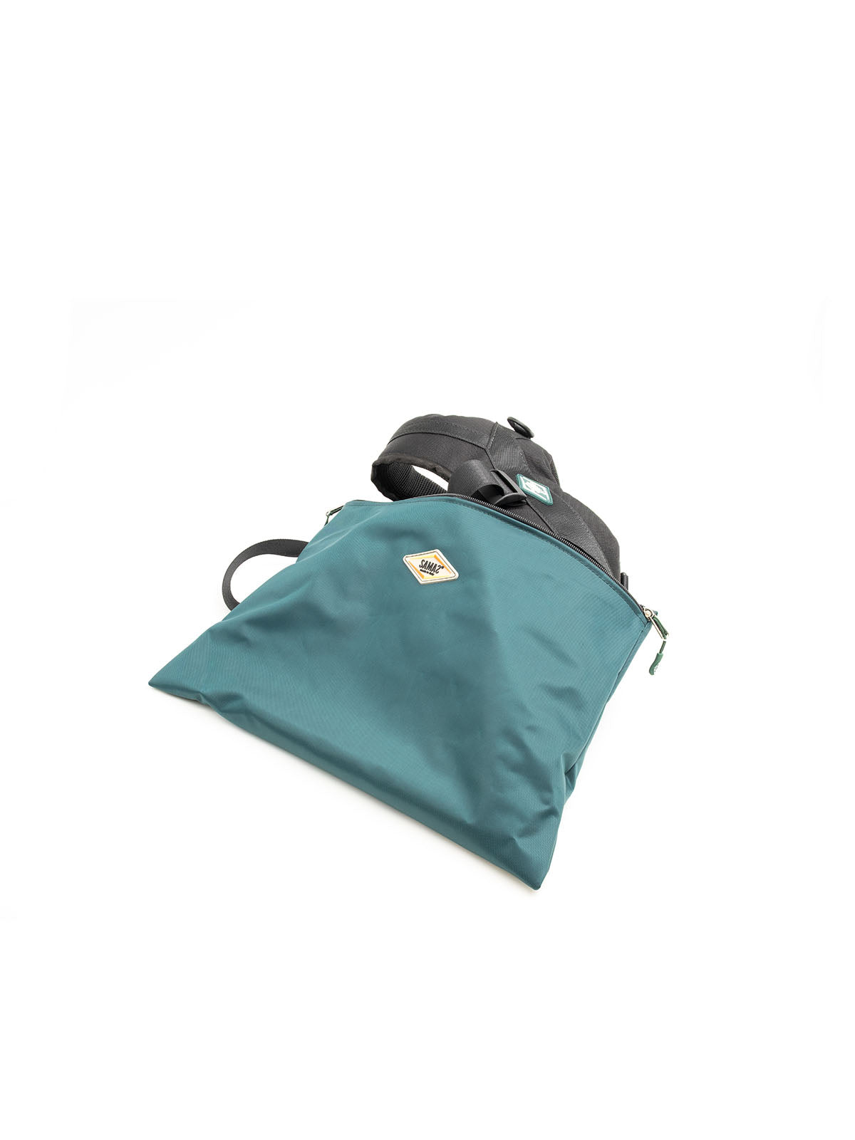 Teal and black tactical harness with organizer pouches and adjustable straps