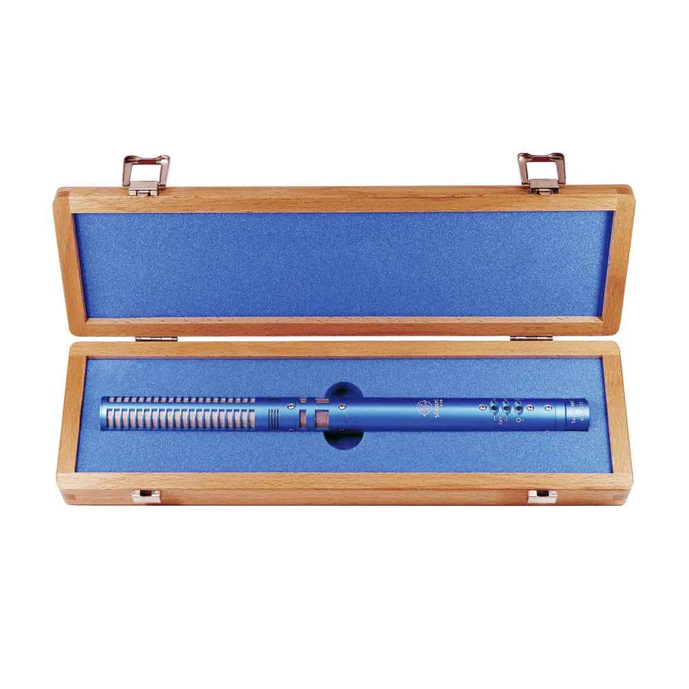 Blue digital shotgun microphone in open wooden case with foam insert