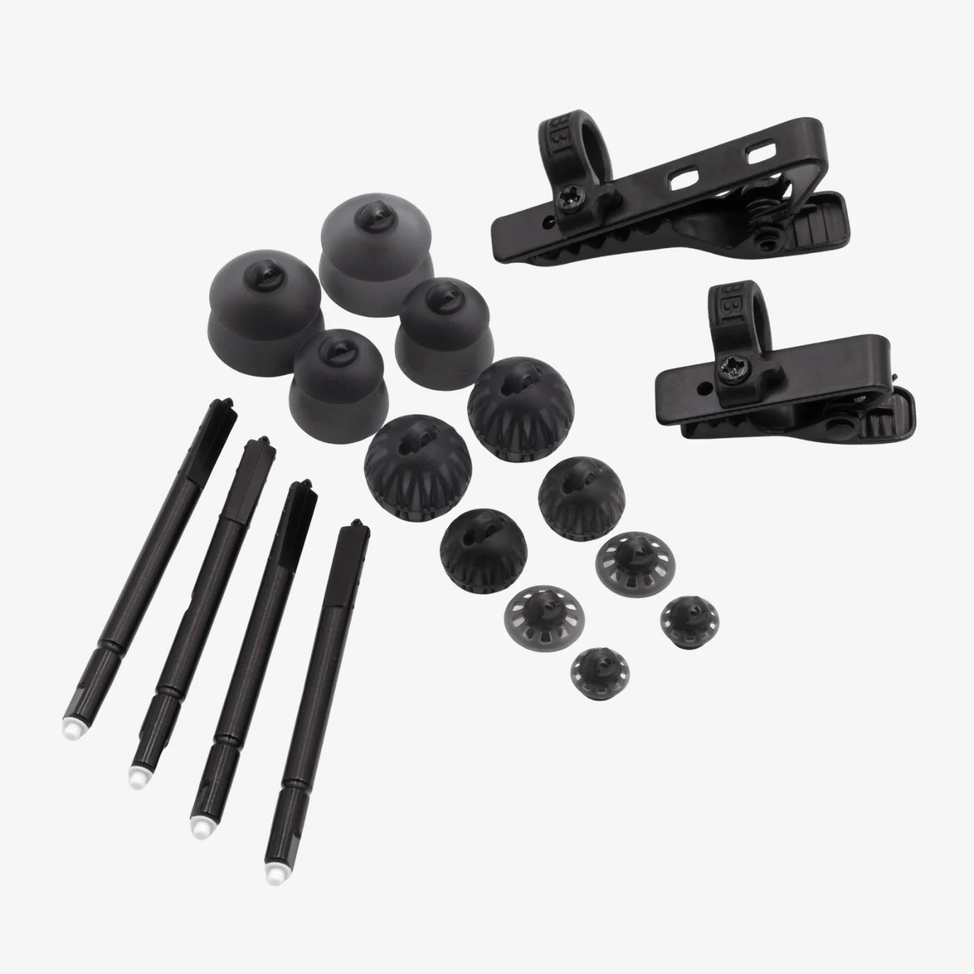Black broadcast earpiece spares: mounting clips, spare tips, and earbud posts