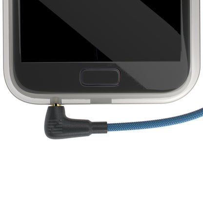 3.5mm audio plug with braided blue cable connected to a device port