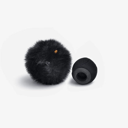 Black fuzzy spacer ball with small yellow dot and black mesh base