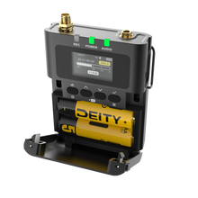 Bodypack transmitter open view showing LCD screen and yellow battery pack