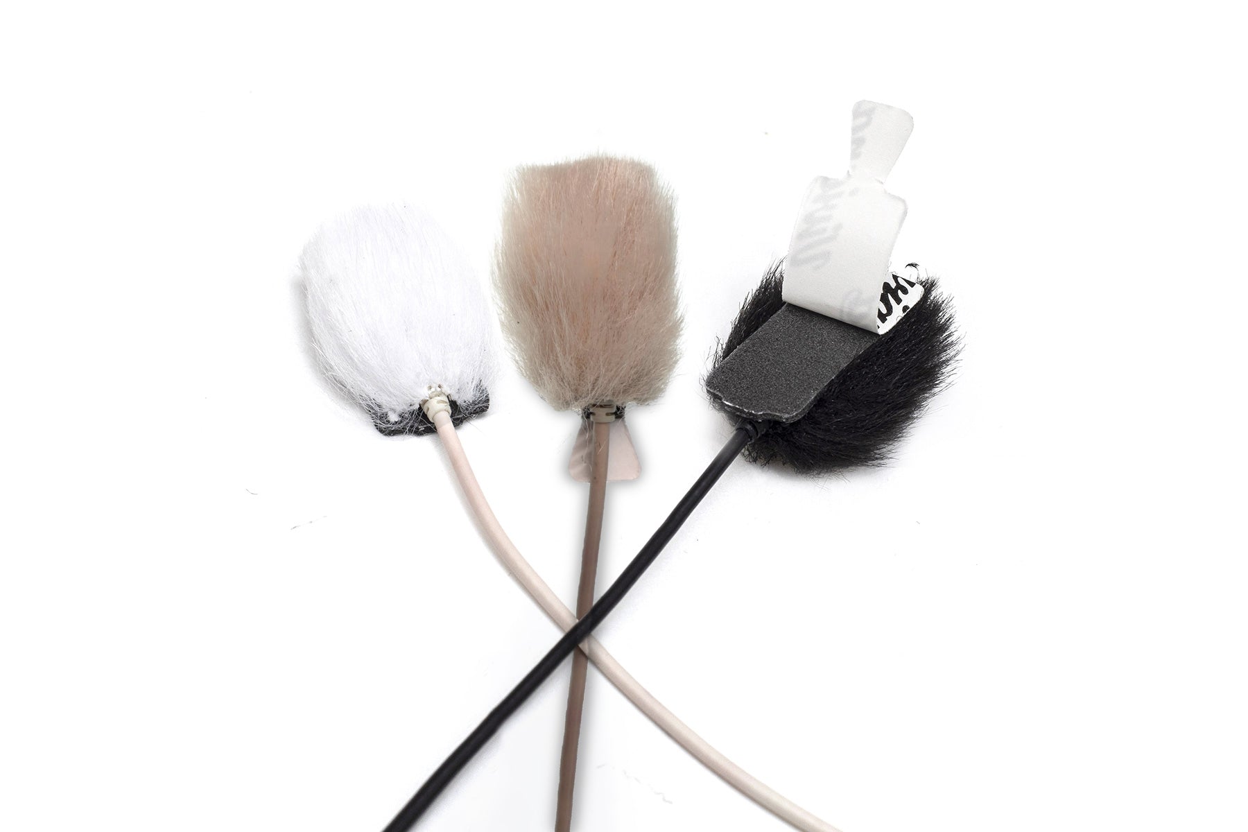 Faux fur applicator set with white, beige, and black rectangular tips on sticks