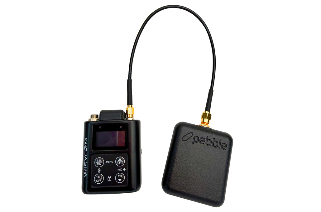 Black Pebble cable adapter with two boxes and gold SMA connectors