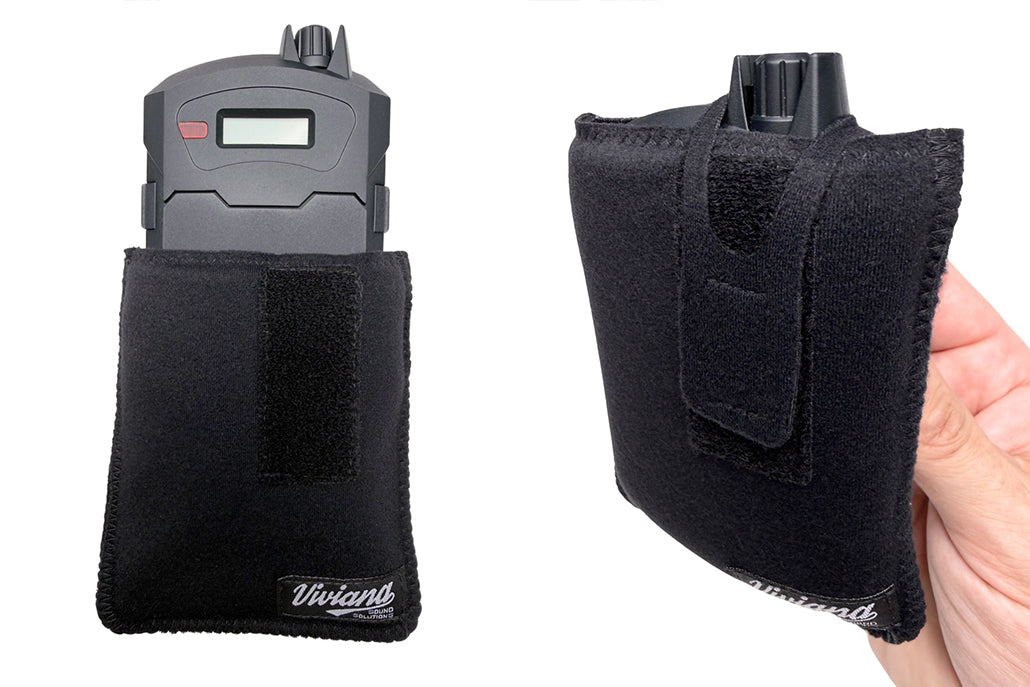 Black fabric pouch with magnetic clip and Velcro flap, held in a hand