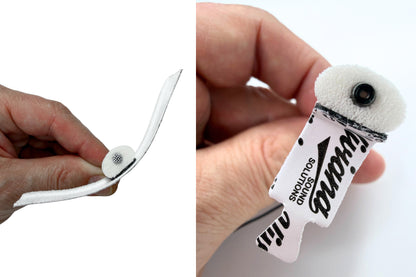 White foam pad attached to a holder, shown close-up from two hand angles