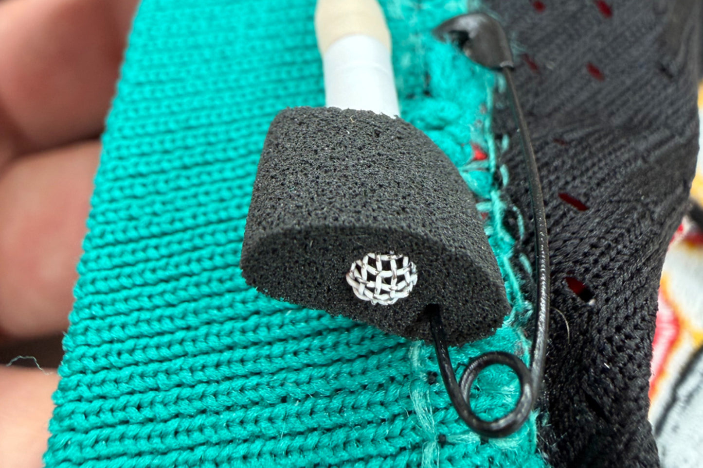 Foam for Lav PRO microphone windscreen close-up on lav mic clip
