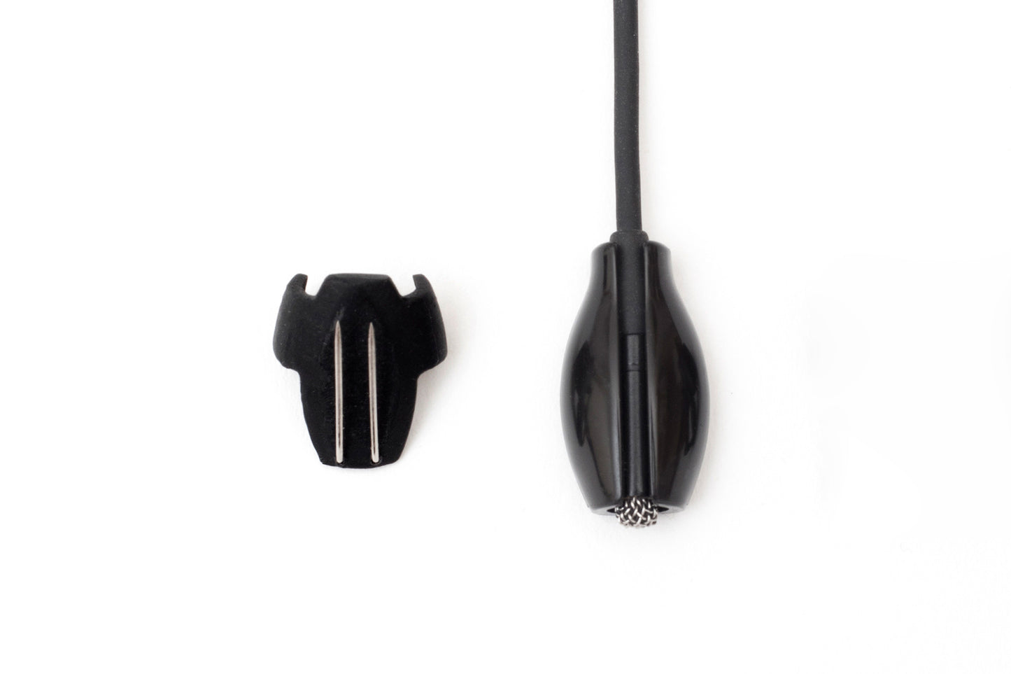 Black beetle-shaped clip with cord and two silver prongs, plus detached black cap