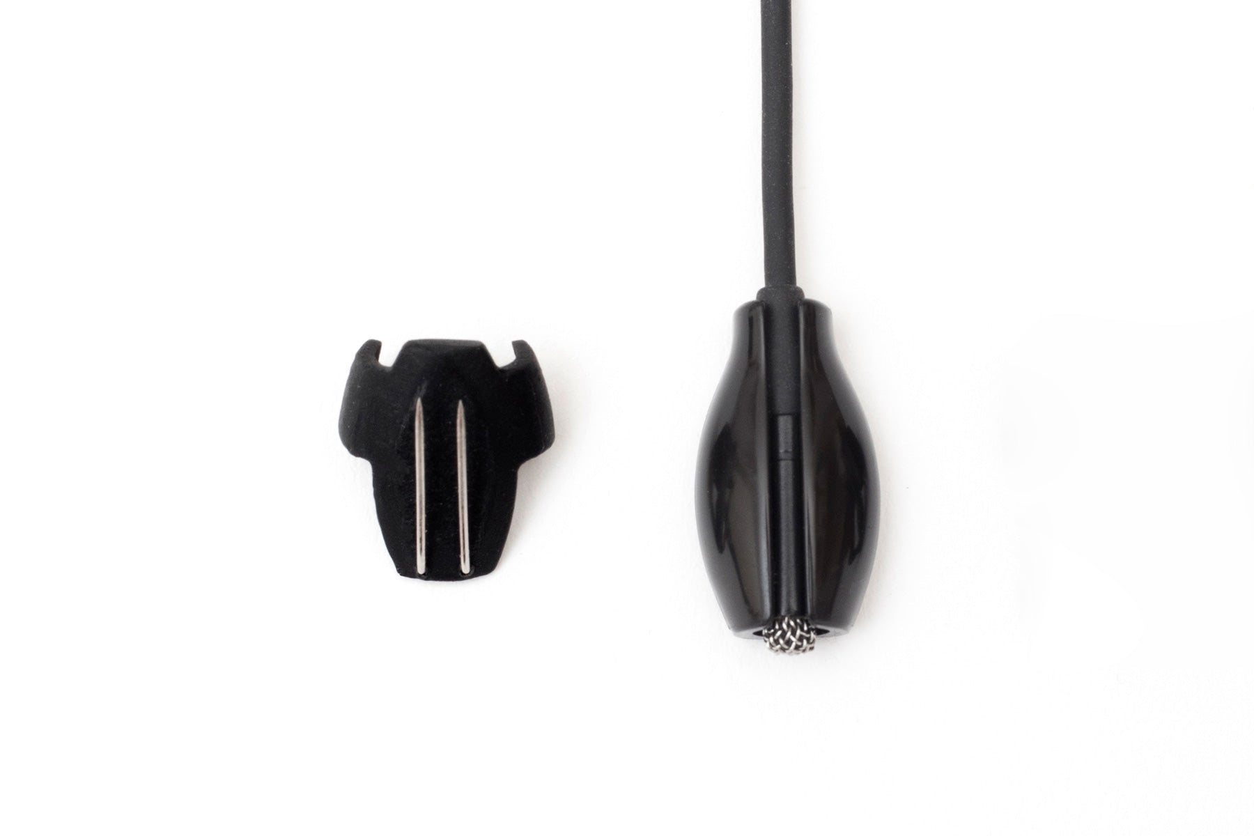 Black beetle-shaped clip with cord and two silver prongs, plus detached black cap