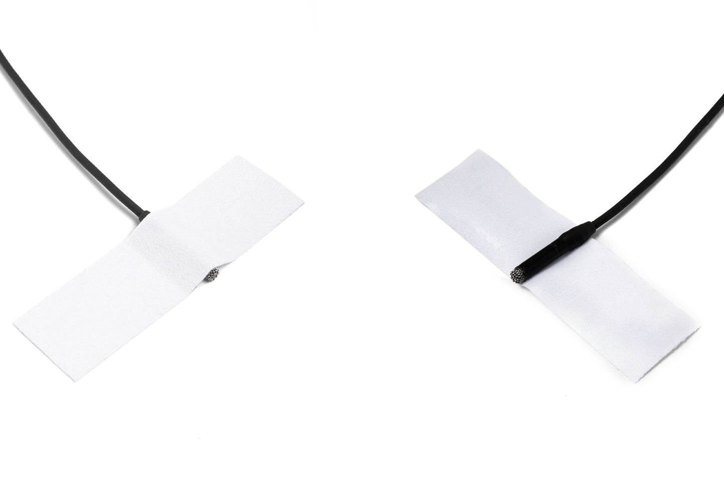 Moleskin Original adhesive patch strips on black cord, two crossed white tabs