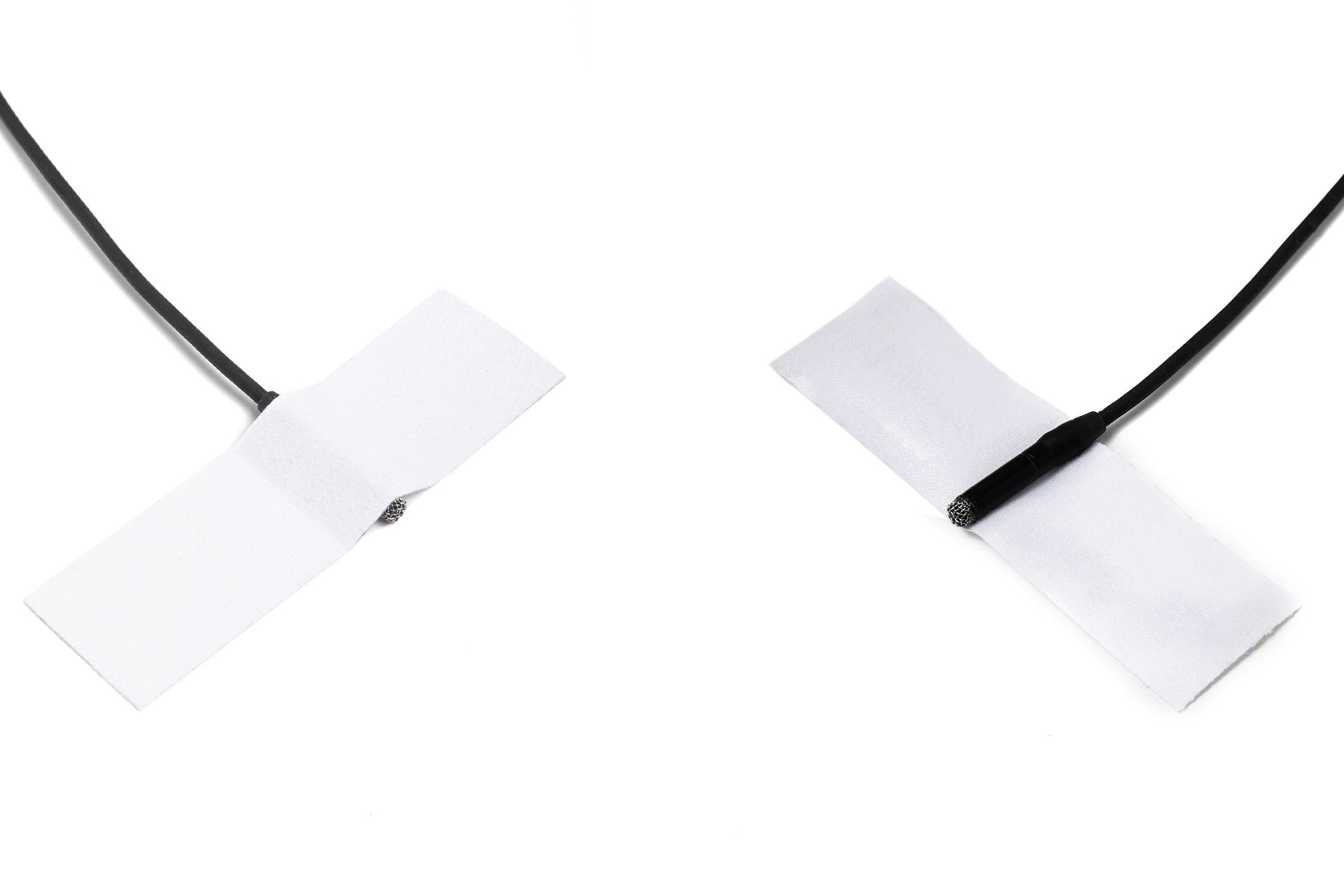 Moleskin Original adhesive patch strips on black cord, two crossed white tabs