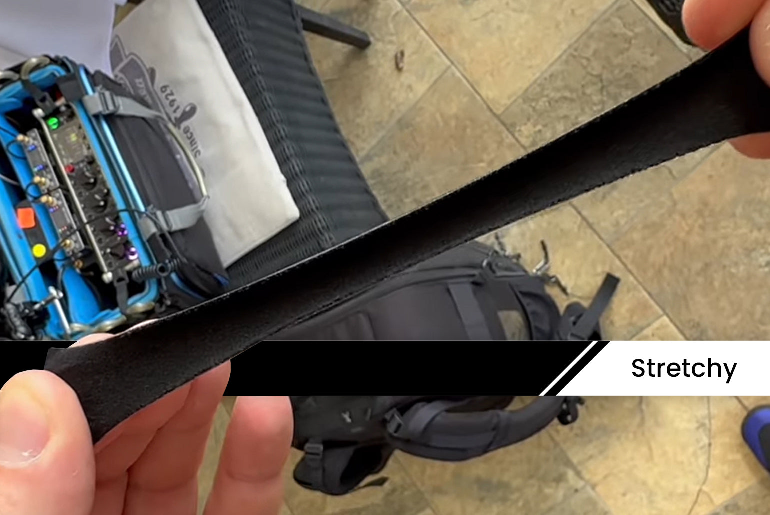 Moleskin Original stretchable black adhesive strip, flexible fabric being pulled