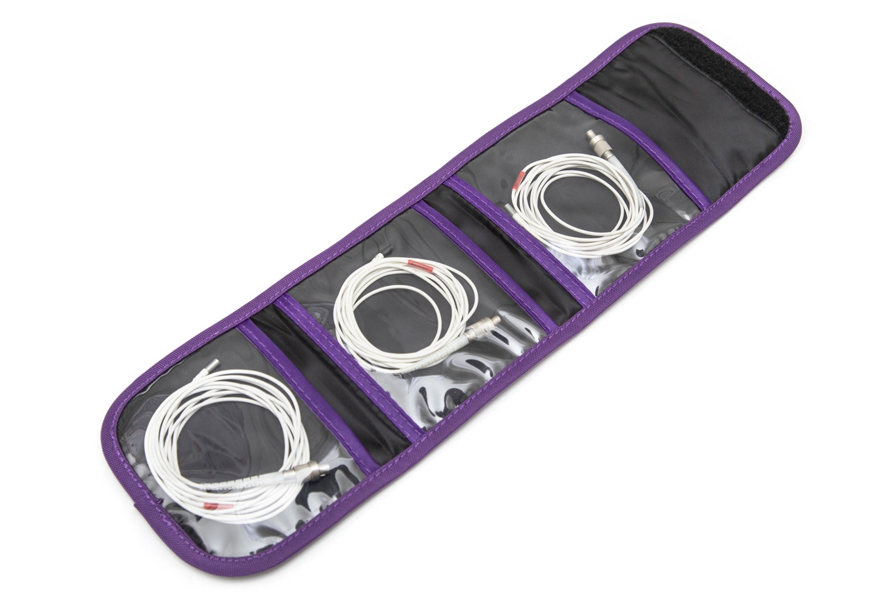 Purple-lined bag with molded slots holding white cables and wires