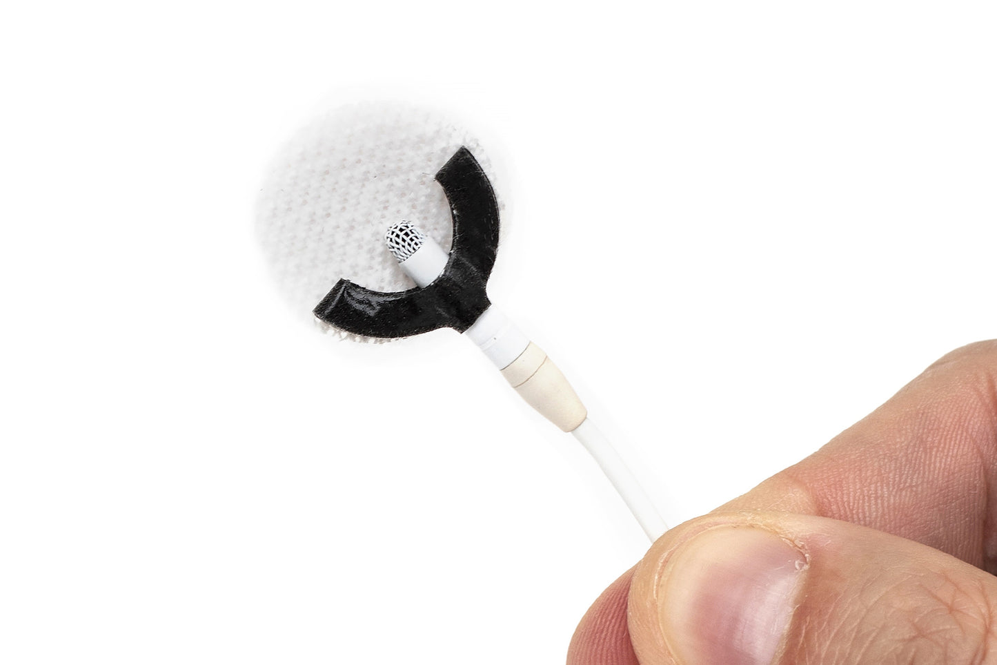 Sticker applicator with curved white foam tip and black segment, handheld
