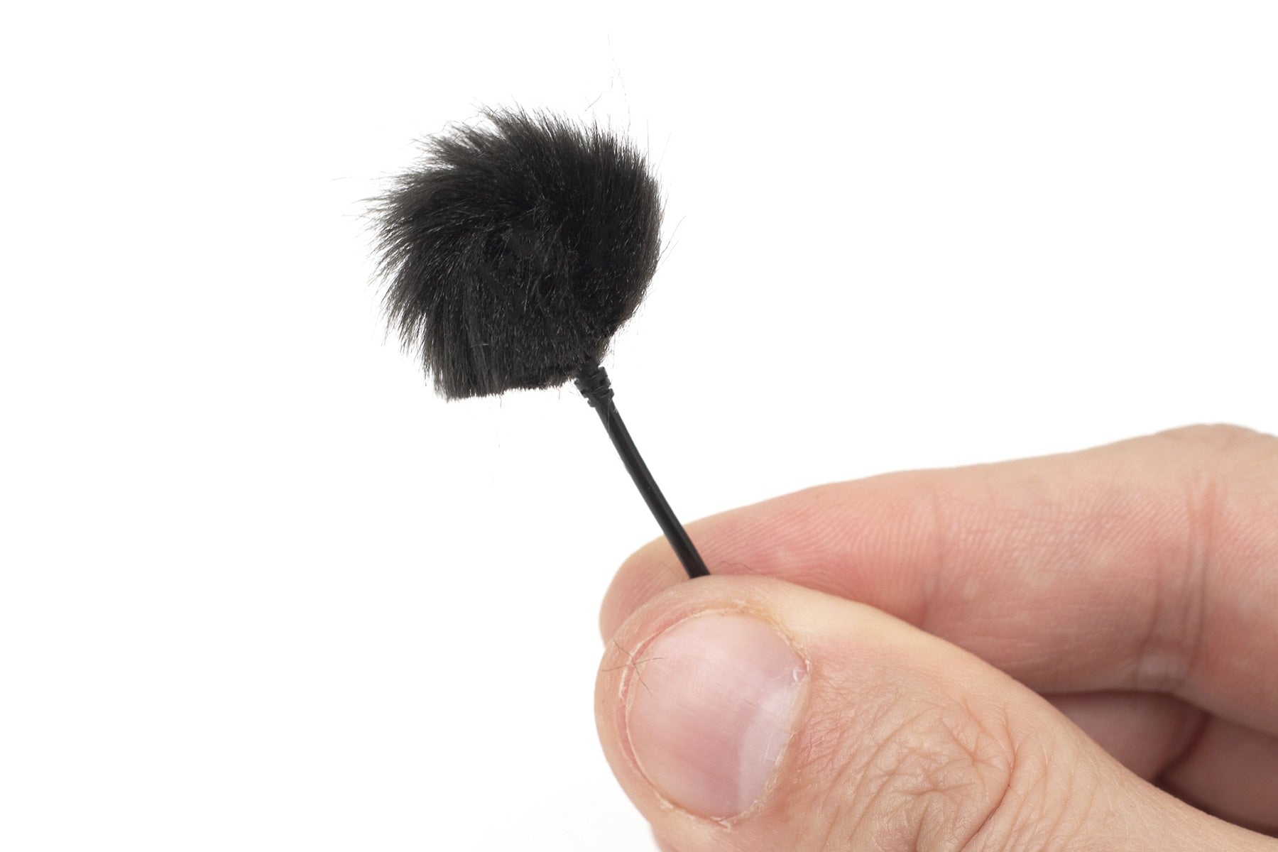 Handheld sticker applicator with black foam brush tip on a thin handle