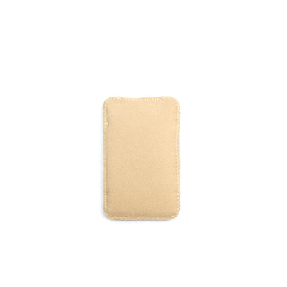 Light beige puffy pouch with stitched edges and compact square shape
