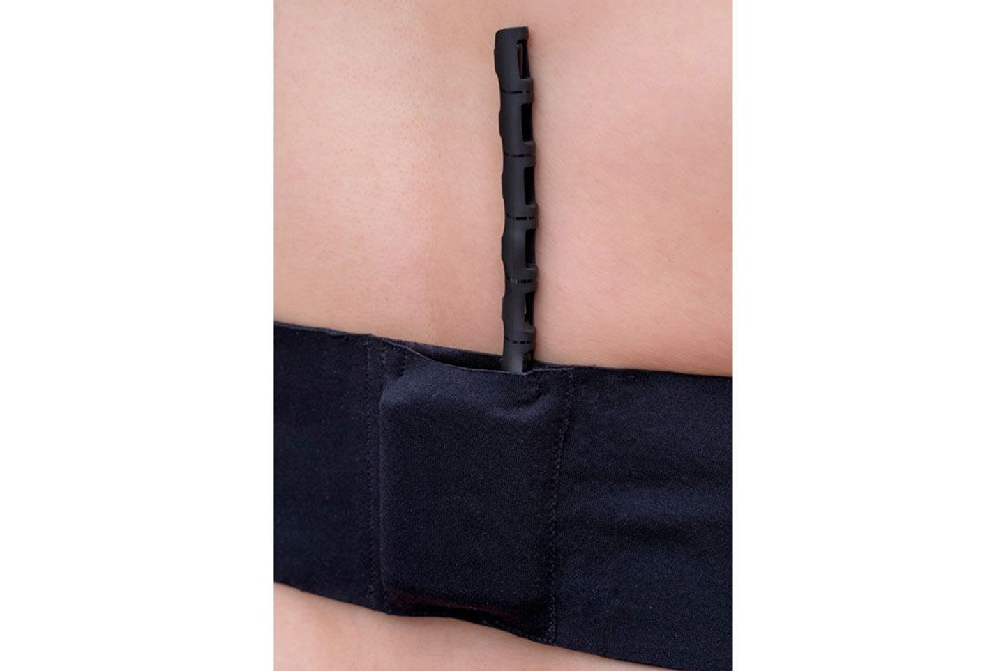 RF Saver black strap band with a central upright connector on a person’s arm