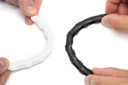RF Saver flexible white and black ring connectors held by hands