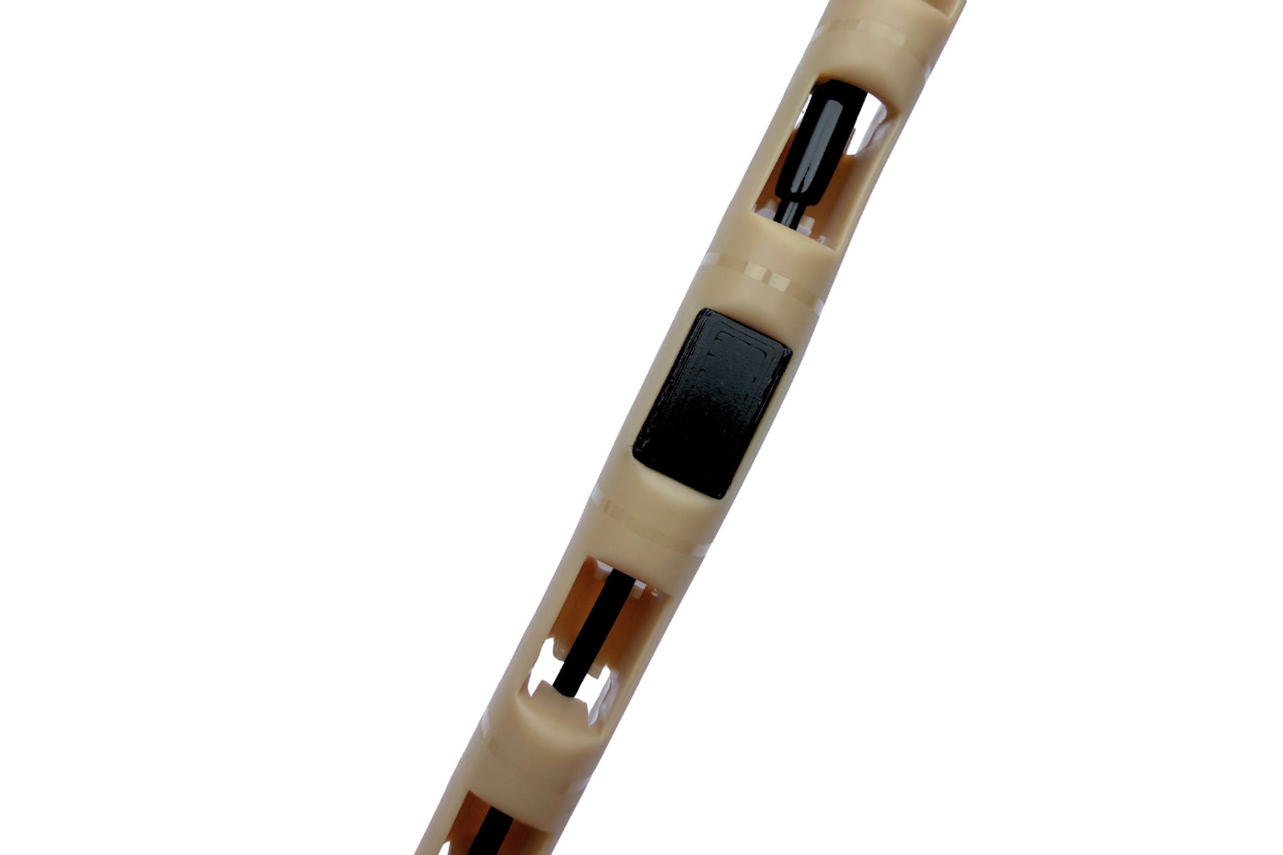 Beige RF whip antenna saver with black and orange detail slots