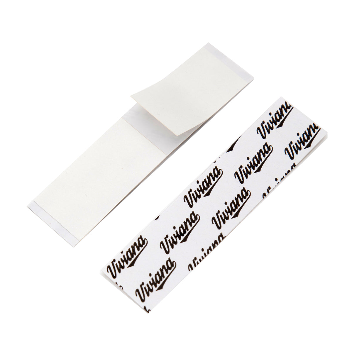 Double-sided white tape strips, overlapping thin rectangular pieces