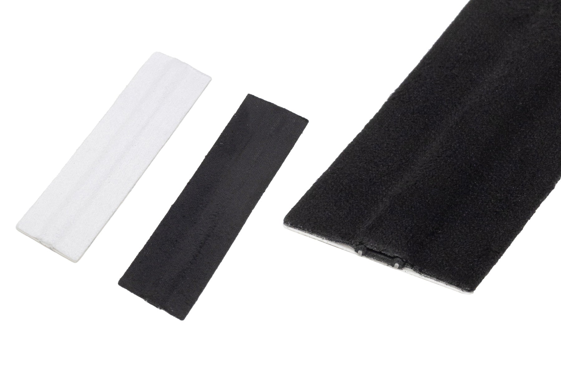Moleskin Extreme fabric padding strips in white, charcoal, and black