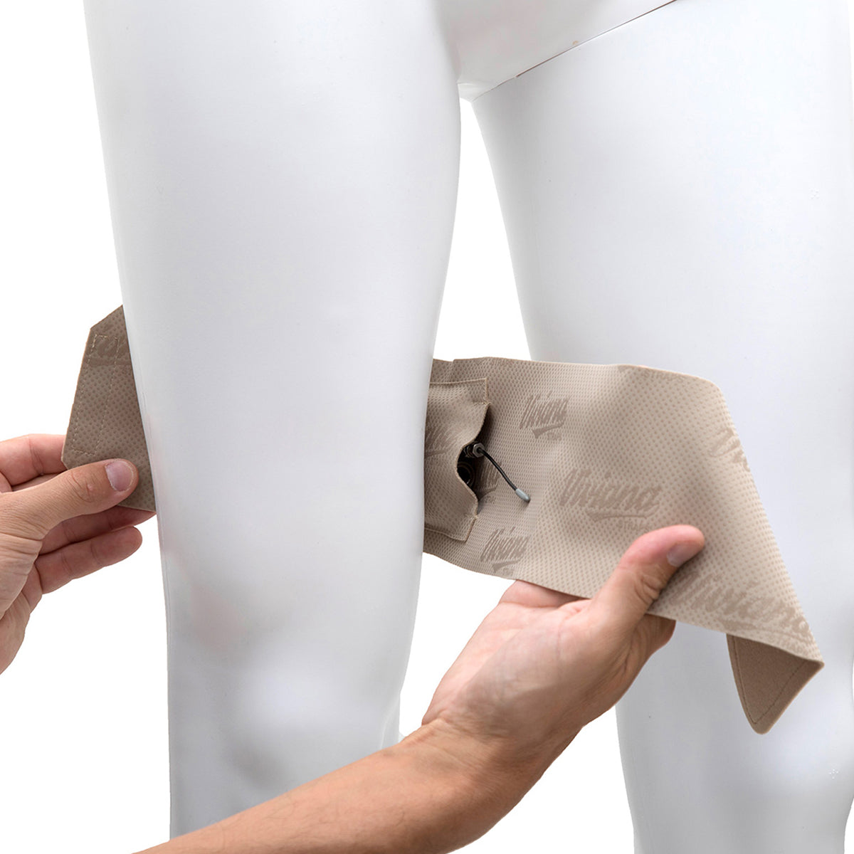 Beige thigh strap pouch being adjusted on leg, with black cord and loop