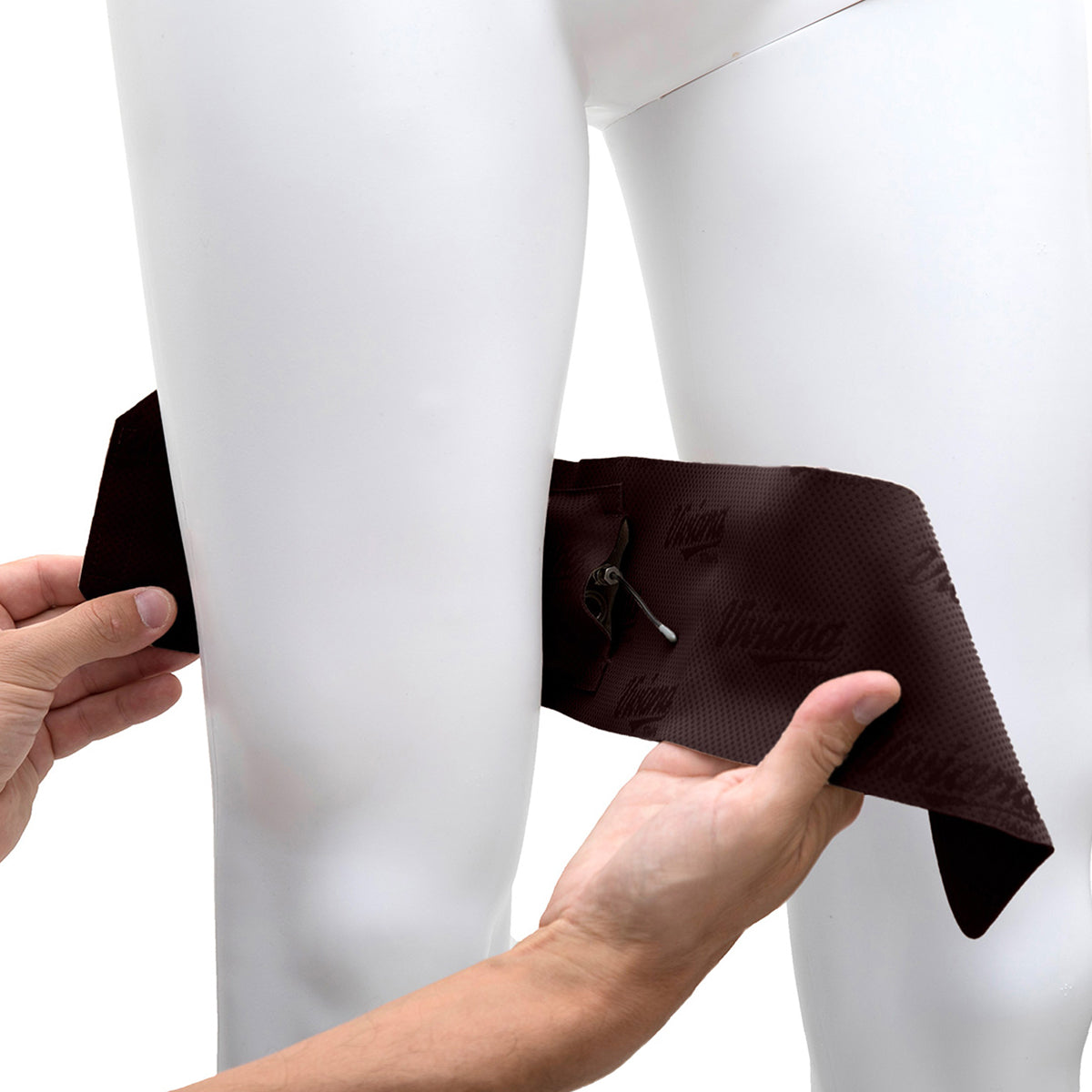 Brown thigh strap pouch being adjusted on leg, with black cord and loop