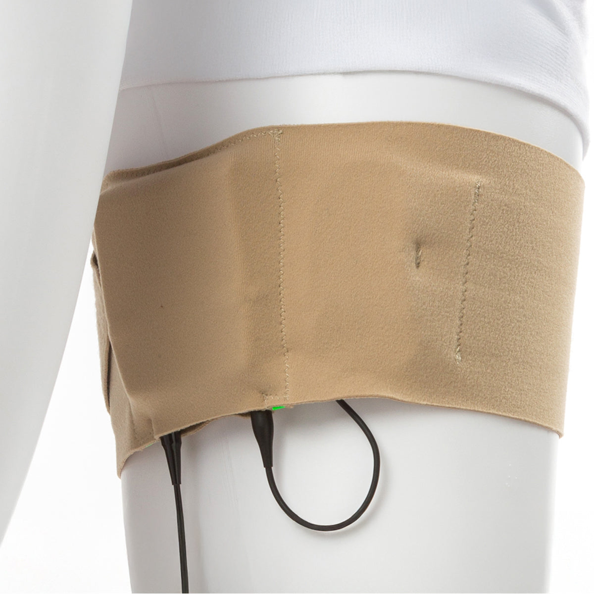Beige thigh strap with black cords and pouch worn on upper leg