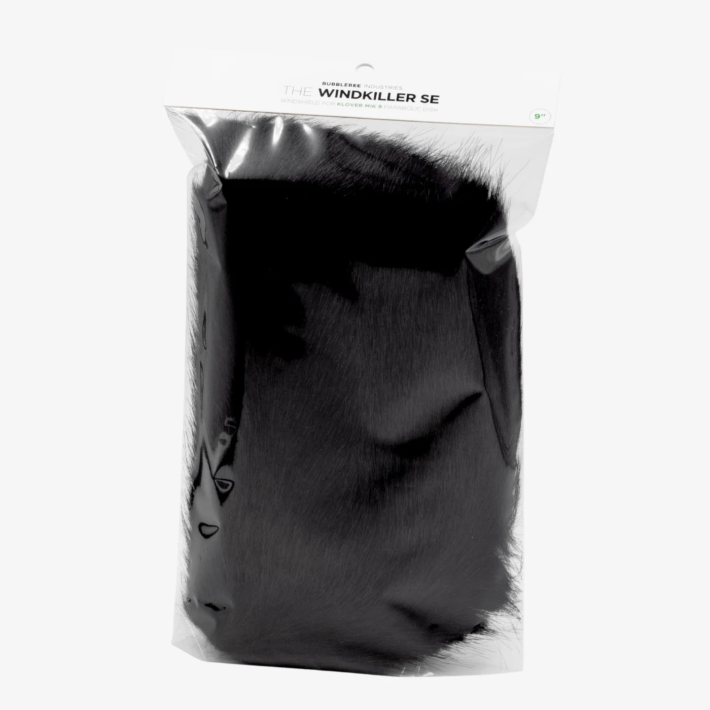 Black faux-fur microphone windscreen with fabric backing, sealed in retail bag