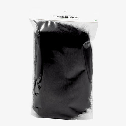 Black faux-fur microphone windscreen with fabric backing, sealed in retail bag
