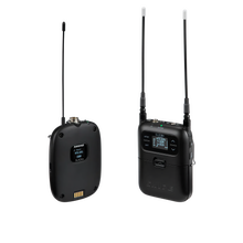 Pair of Shure wireless transmitters with LCD screens and tall antennas, black