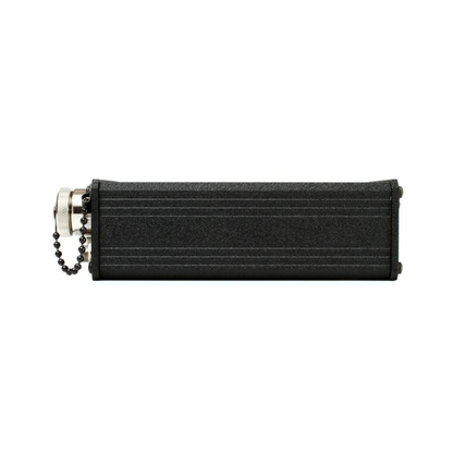 Black headphone amplifier housing with side connectors and cable chain
