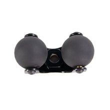 Swing arm clamp with two dark spherical ends and central metal bracket