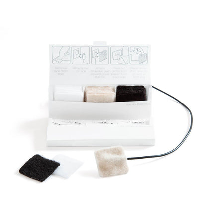 Lav mic cover kit with adhesive pads and attached cable