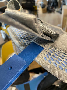 Orca back support for OR-40 harness: beige mesh pad with blue attachment strap detail