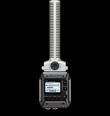 Zoom F1 field recorder with attached shotgun microphone, LCD screen and controls