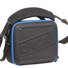 Medium hard shell accessory bag, charcoal gray with blue zipper and ORCA embossed front