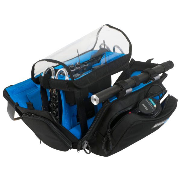 Black and blue audio mixer bag with padded compartments, open top, and zipper closures