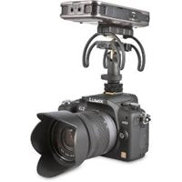 Portable recorder suspension with metal mount and clamps holding a small camera