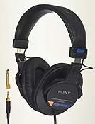 Sony MDR-7506 over-ear headphones, black with blue accents; includes audio cables with plugs