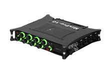 Black audio mixer with green illuminated knobs and control buttons on top panel