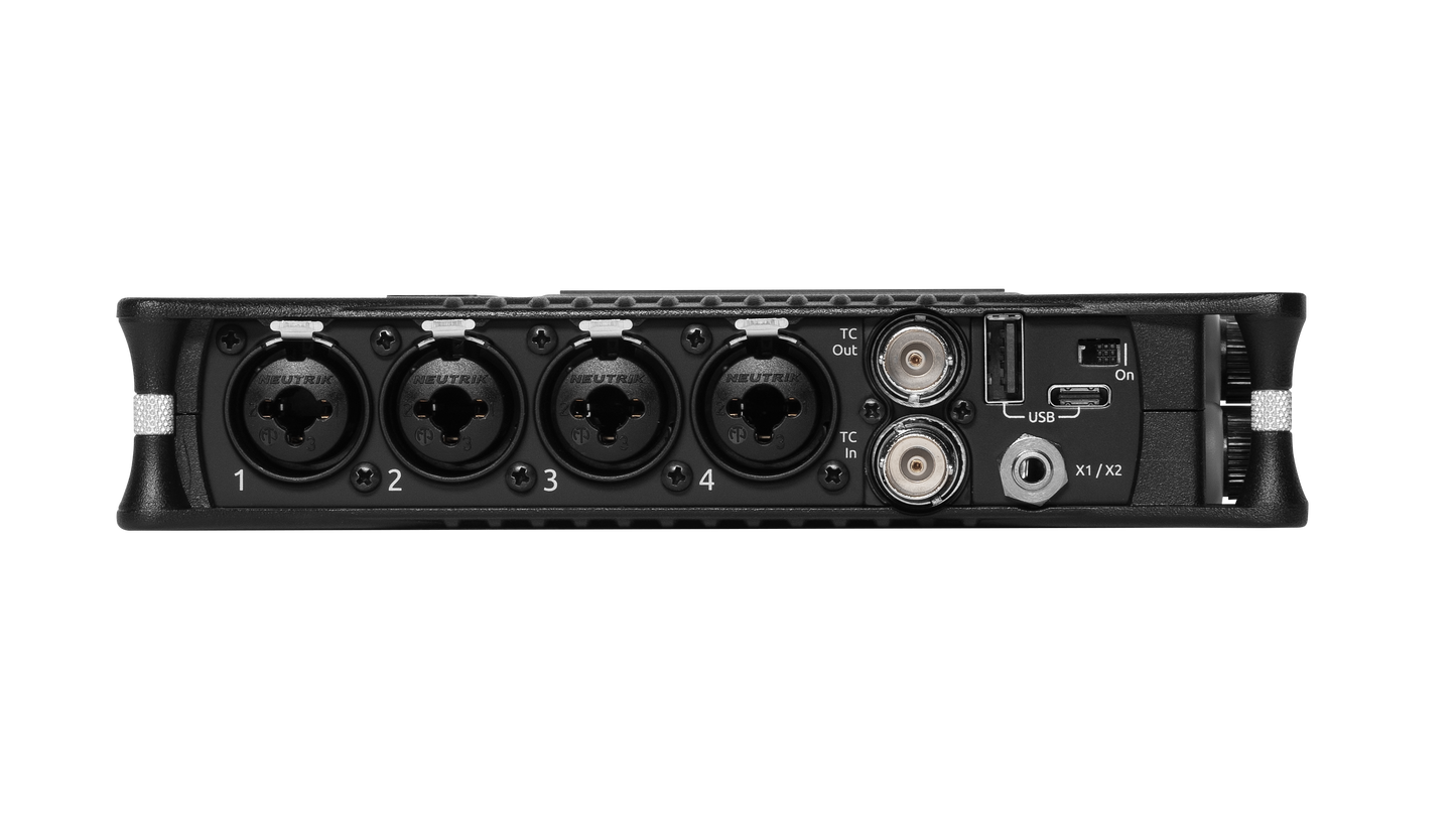 Black audio mixer rear panel with audio inputs and USB/connector area