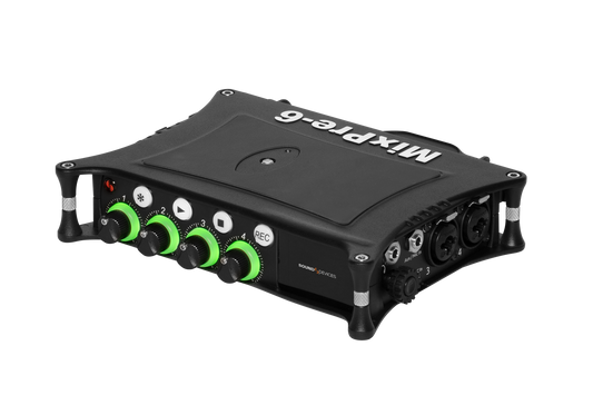 Black audio mixer/preamp with green control knobs and top panel switches