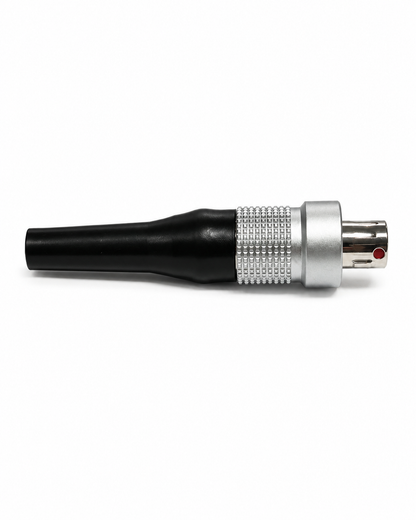 Black and silver audio connector plug with red indicator near metal contacts