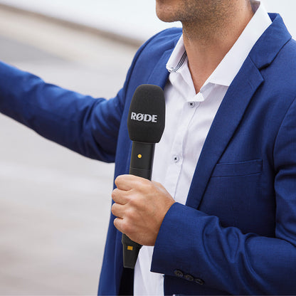 Reporter using the RØDE Interview PRO microphone