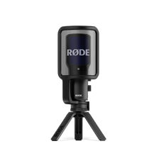 Black USB condenser microphone front view with blue grille mesh and stand
